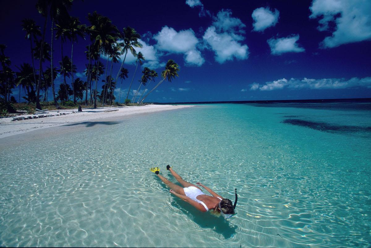 Take just a few steps off the beach and you can immerse in world-class snorkelling. Copyright James Watt