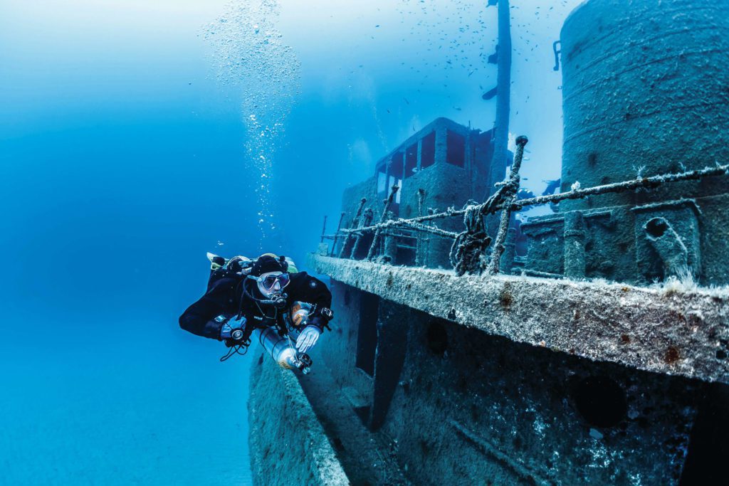 Diver Alongside a Wreck - 3 Safety Considerations For New Wreck Diving