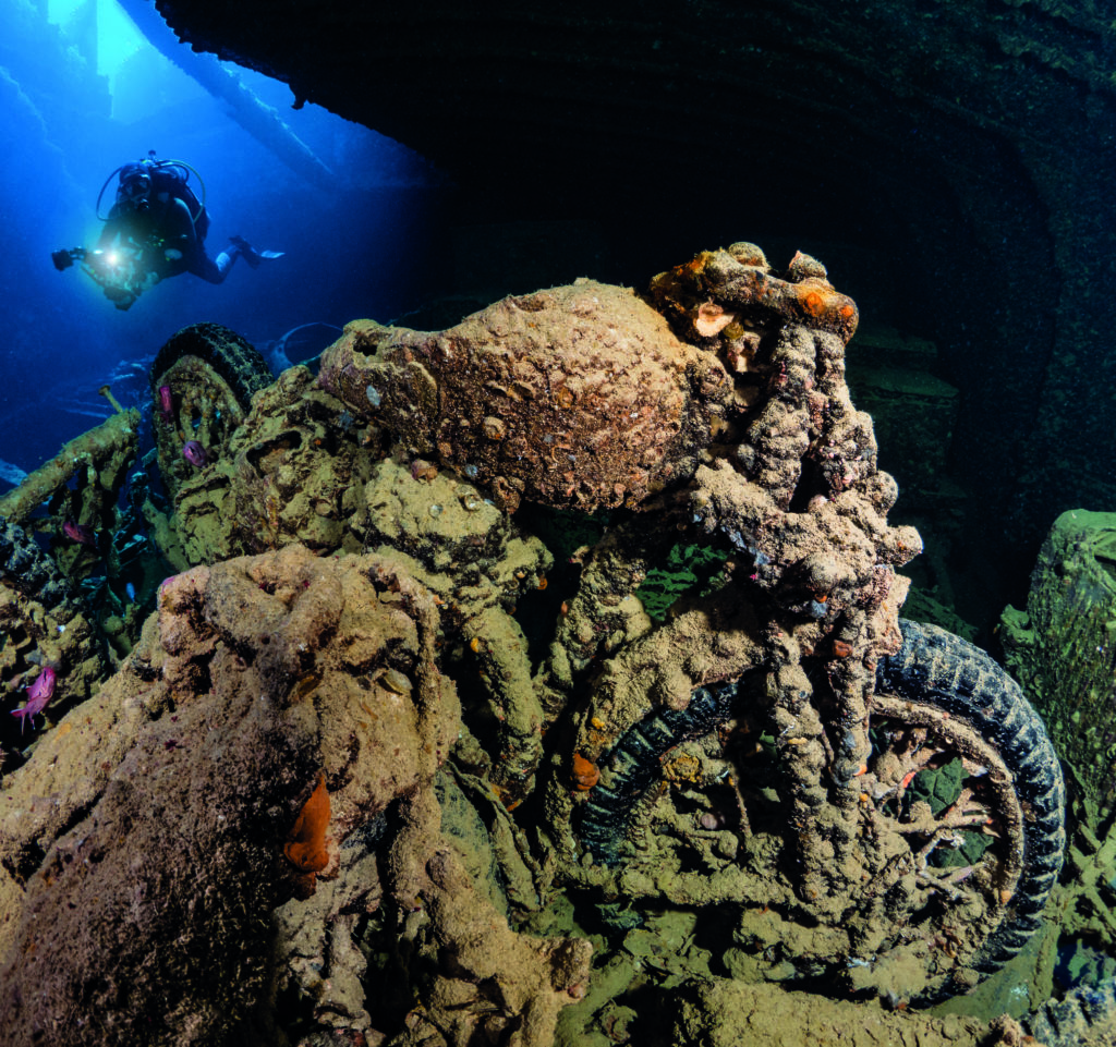 Thistlegorm Bike - This juxtaposition of diver in background and bike to the fore, lent itself perfectly to the square cropping which I applied using the content aware scale rule in Photoshop