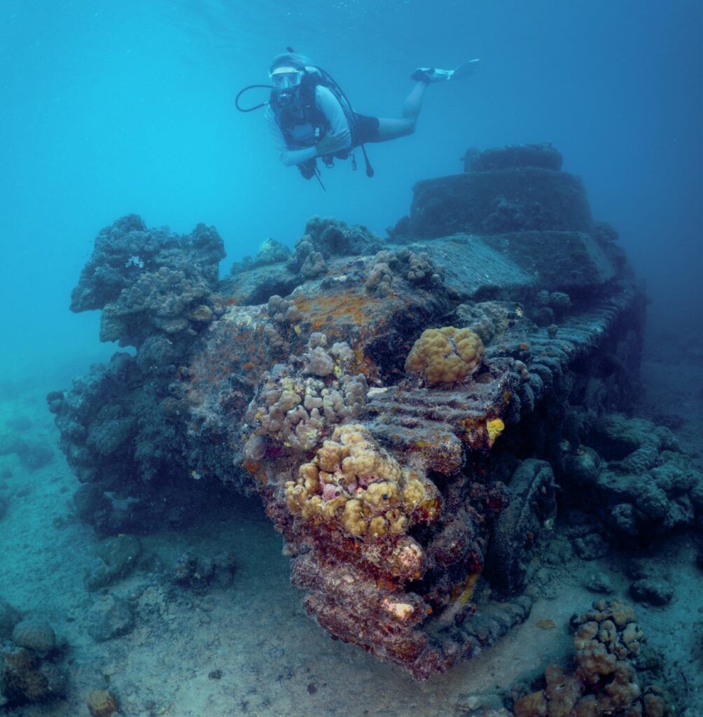 Coral-encrusted tank on the seabed