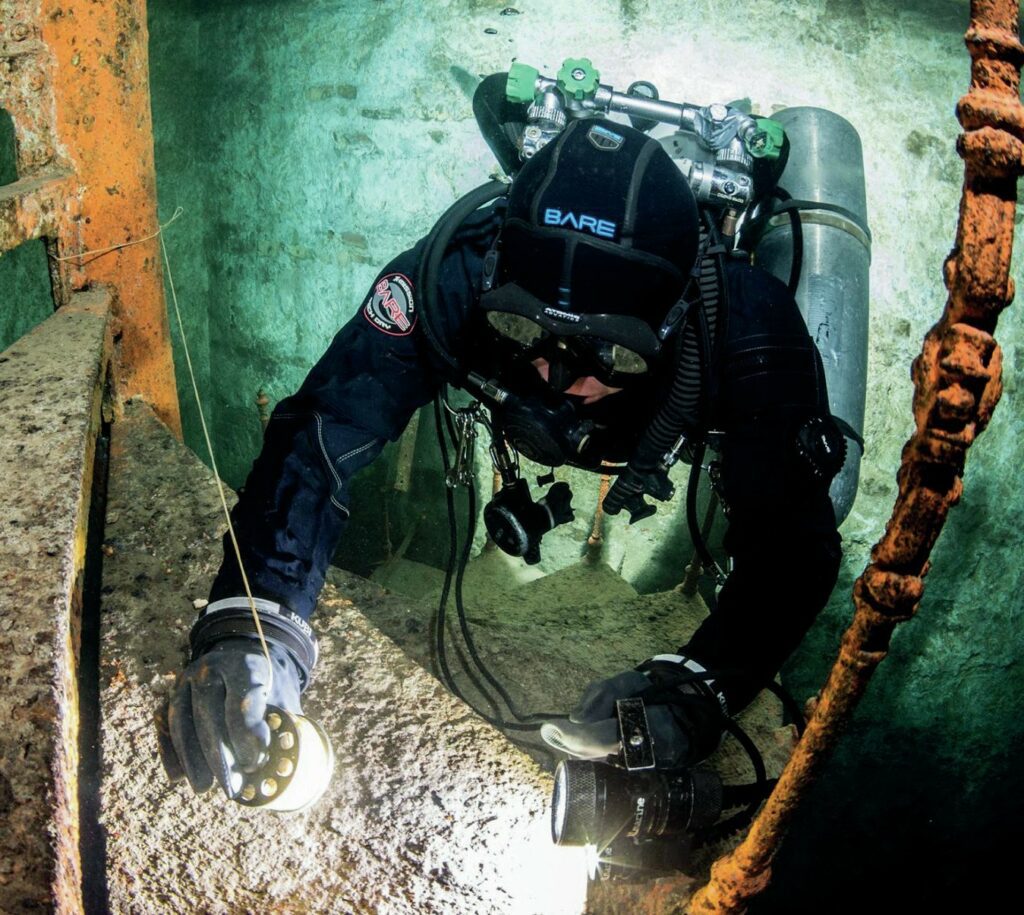 Padi scuba diver near stairs underwater