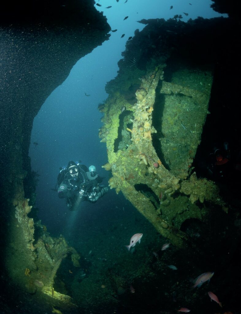 Diver exploring a break in the J2 wreck ©Ben Claydon