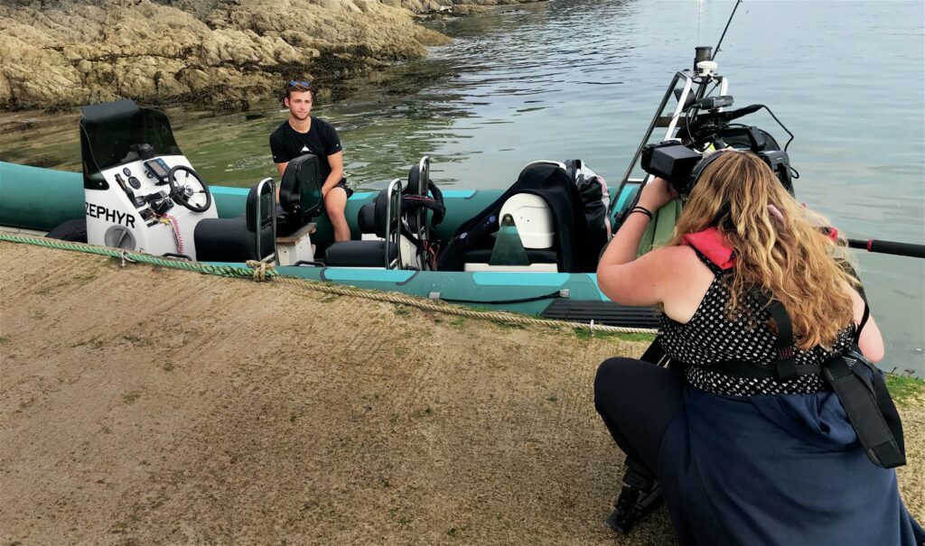 Scuba diving getting photo taken on boat