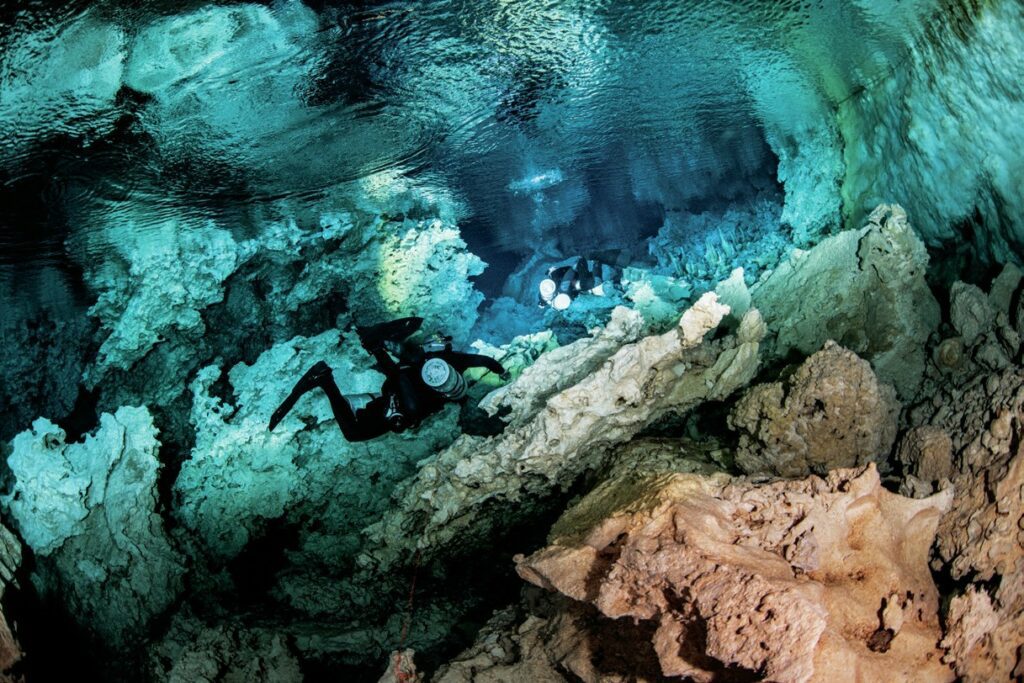 The dive team head into a cave system