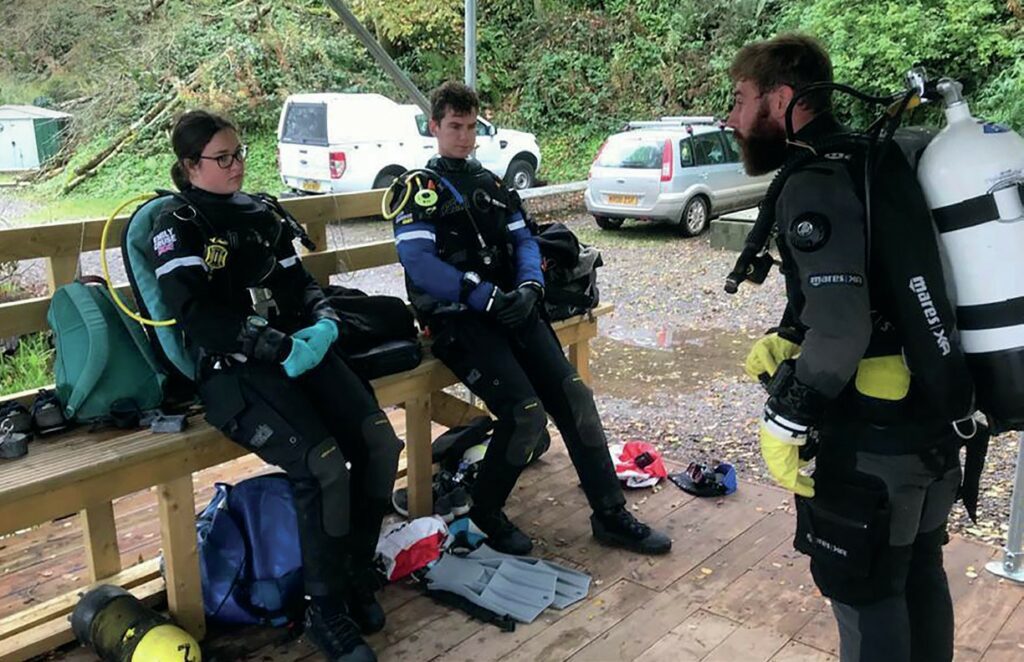 Scuba divers doing dive brief