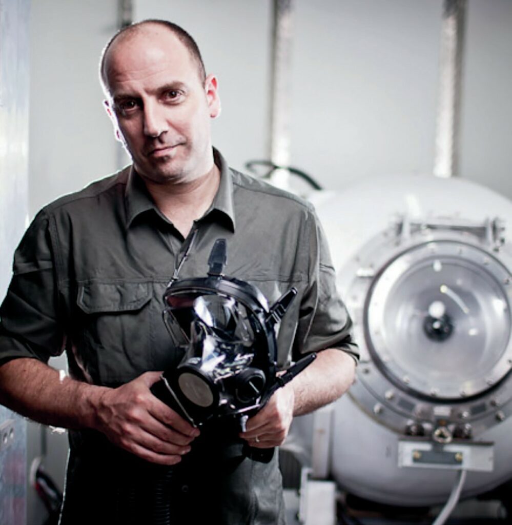 John Garvin holding rebreather creation