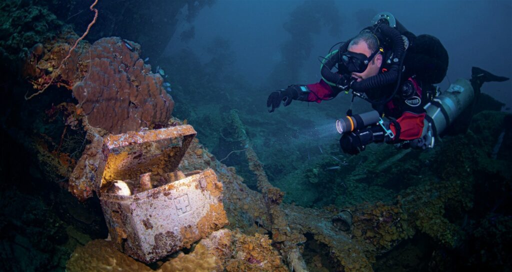 Scuba diver exploring wrecks in Truk
