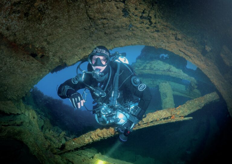 Swimming through submarine wreck ©Ben Claydon