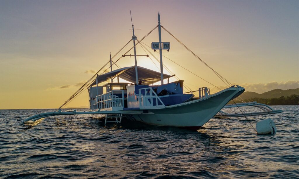 Dive boat at sunset