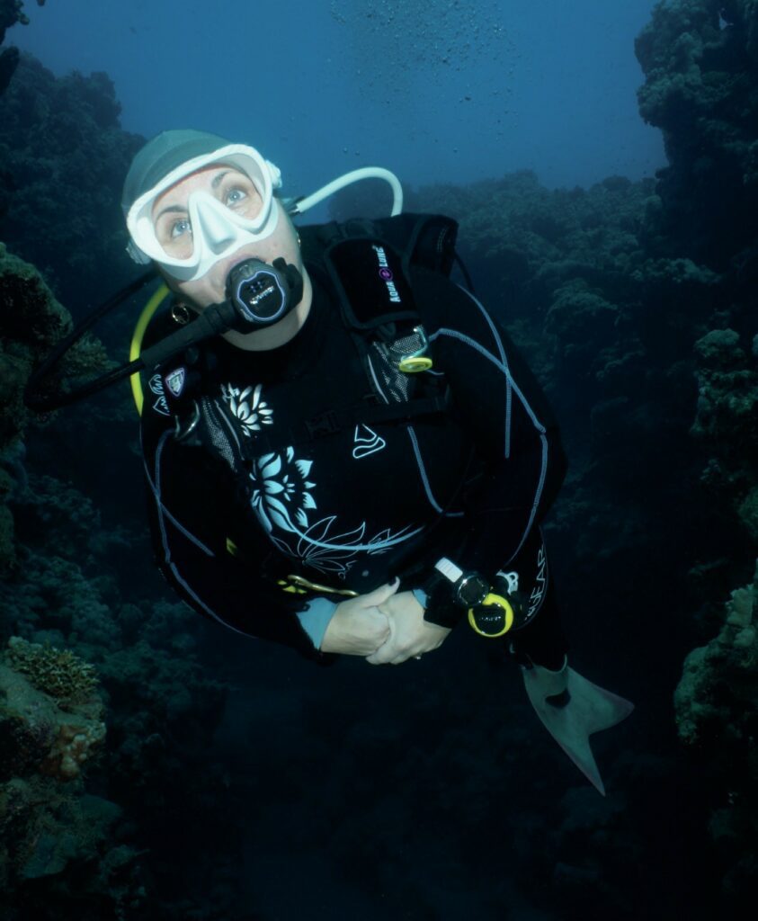 Diver geared up underwater