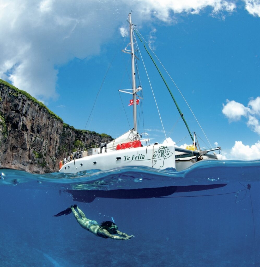 Snorkelling under a catamaran