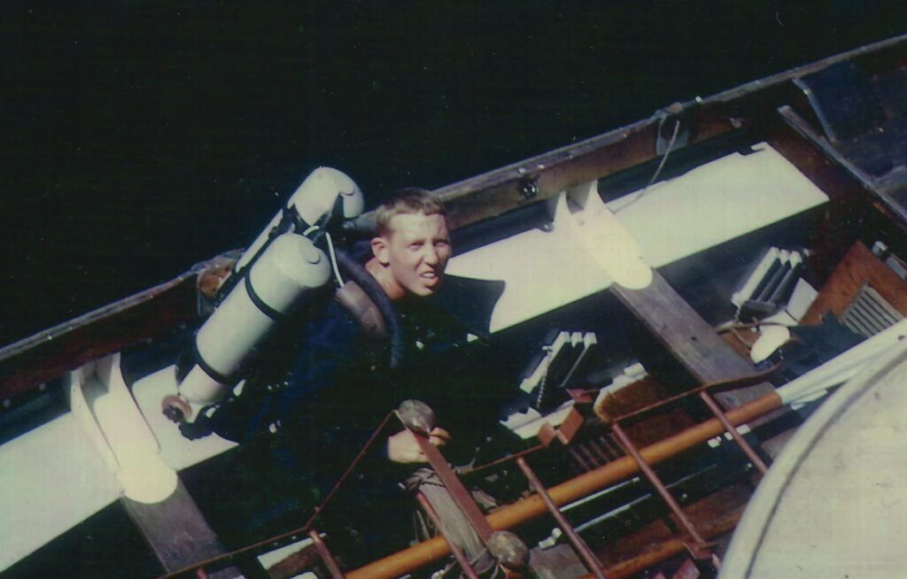 David about to carry out a hull search. Borneo 1965